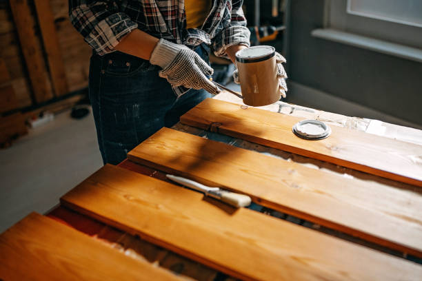 istock Woman opening paint can 1130372884