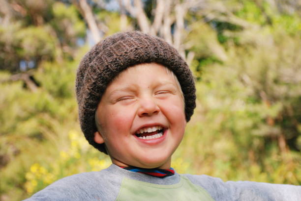 istock Child in Wool Hat in Rural Scene in Winter 1130372939
