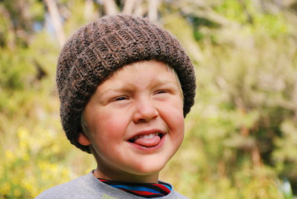 istock Child in Wool Hat in Rural Scene in Winter 1130372940