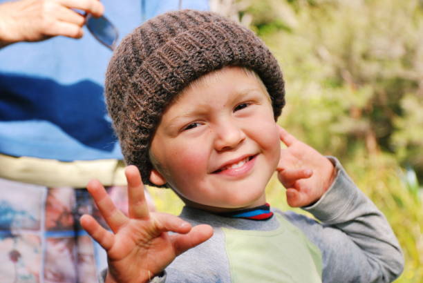 Child in Wool Hat in Rural Scene in Winter