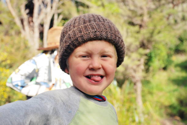 Child in Wool Hat in Rural Scene in Winter