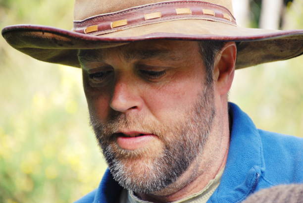 istock Man in Cowboy Hat in Rural Scene in Winter 1130372980