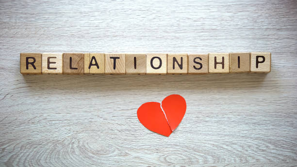istock Relationship word on cubes, broken heart connected, reconciliation after parting 1130373140