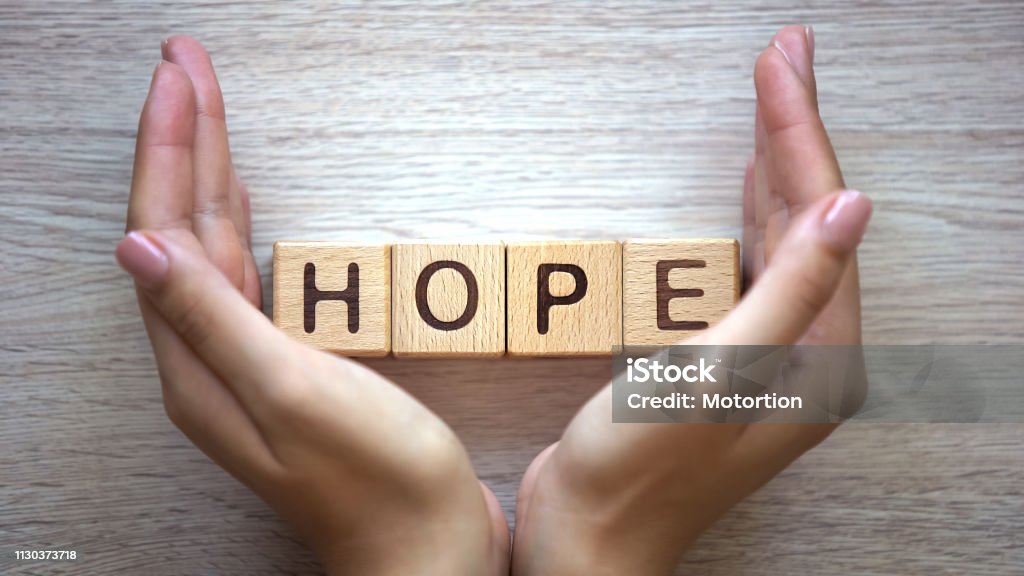 Hope word made by female hands, family creation, expectancy of baby, happiness Hope - Concept Stock Photo