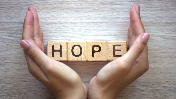 Hope word made by female hands, family creation, expectancy of baby, happiness Hope word made by female hands, family creation, expectancy of baby, happiness respect photos stock pictures, royalty-free photos & images