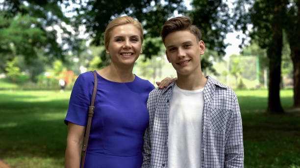 istock Happy son and mother looking at camera, 1st year student, university life start 1130374265