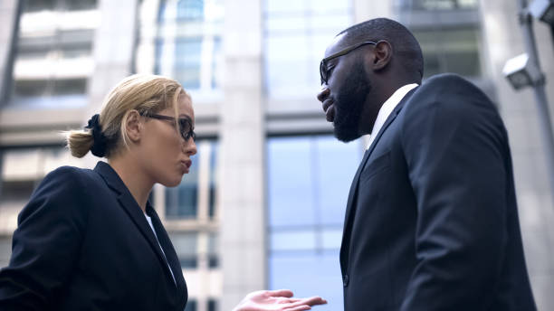 istock Female boss scolding subordinate, employee justifying himself, business ethics 1130374351