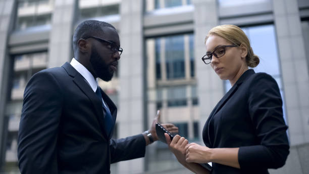 istock Angry boss scolding secretary about deadline, troubles at work, corporate ethics 1130375064