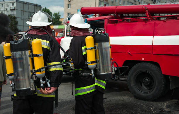 istock fireman extinguishes the fire with smoke. Firefighting exercises with fire extinguishing. 1130375435