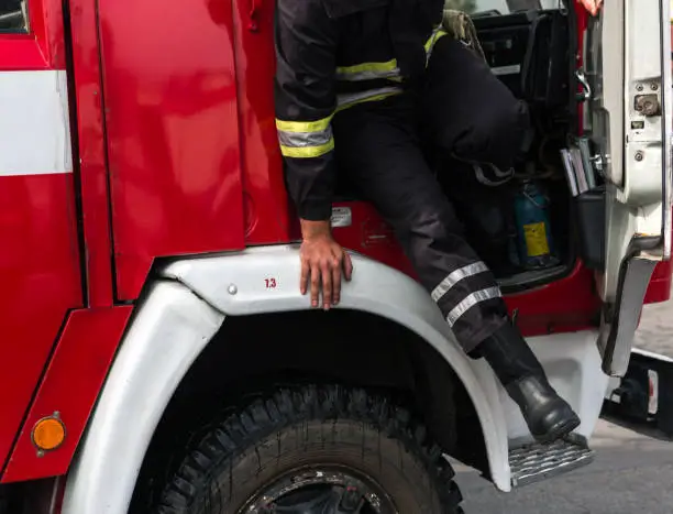 fireman extinguishes the fire with smoke. Firefighting exercises with fire extinguishing.