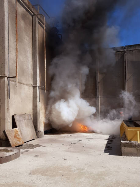 istock fireman extinguishes the fire with smoke. Firefighting exercises with fire extinguishing. 1130375454