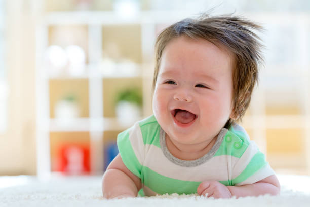 istock Happy baby boy lying down 1130377504