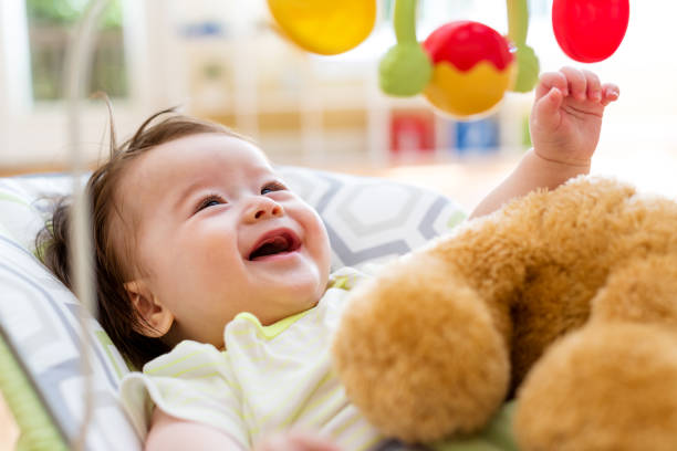 istock Baby boy playing with his toy 1130377558