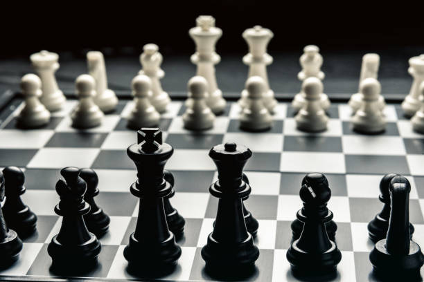 istock Chess board with black and white chess facing each other 1130378147