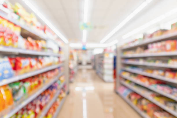 istock Supermarket aisle interior shelves blur background 1130379661