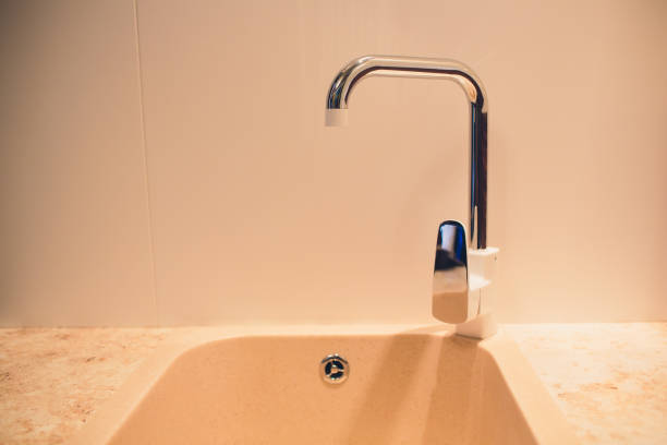 istock Bathroom interior with sink and white faucet. 1130382733