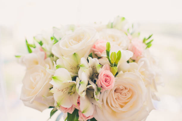 istock bride holds a beautiful wedding bouquet. color. 1130382771