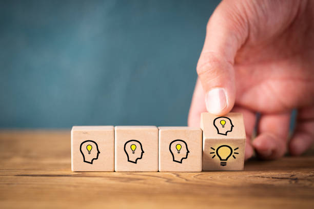 istock many people together having an idea symbolized by icons on cubes 1130383058