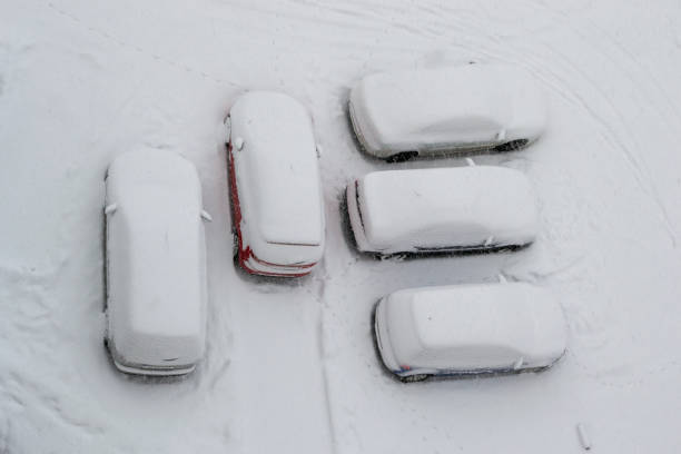 istock Five parked cars covered with snow during a Winter blizzard. Heavy storm making people leave their cars at home, for safety reasons. 1130385689
