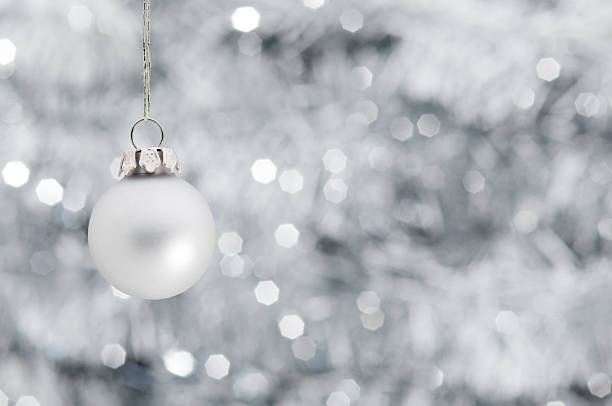 istock Christmas ball over shiny silver garland background 113038872