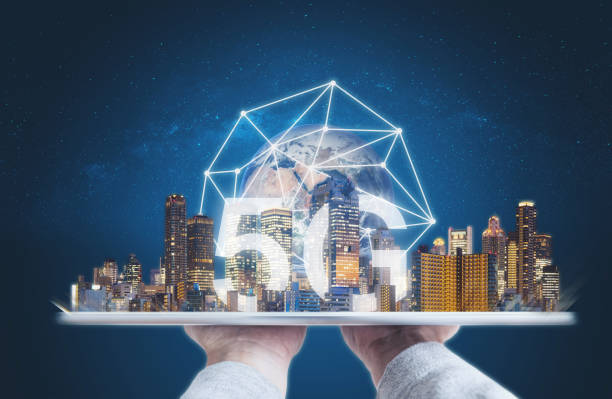 istock 5G internet network and technology, Hand holding digital tablet with buildings and 5g network connection. Element of this image are furnished by NASA 1130391030