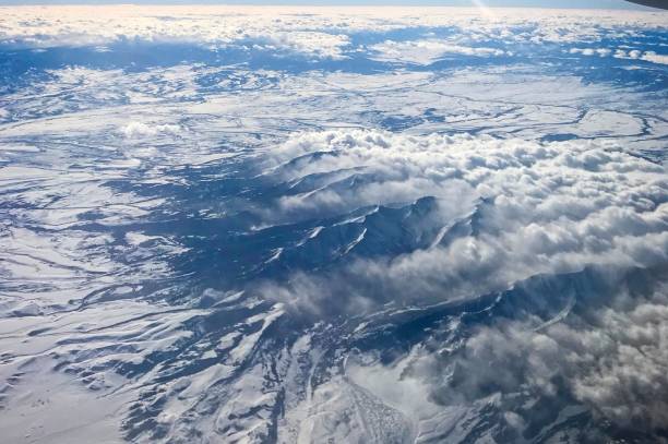 istock View of mountains from airplane flying above 1130392978