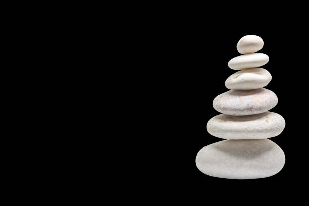 stacked pebbles isolated stock photo