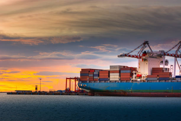istock Transportation and Shipping Logistics Loading Dock Terminal., Container Import and Export of Sea Freight Transport Industrial., Landscape of Port Maritime and Harbor Cargo Shipyard With Crane Bridge. 1130395038