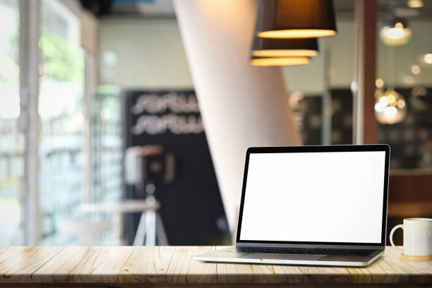 istock Mockup blank screen laptop on white desk table in office 1130395880