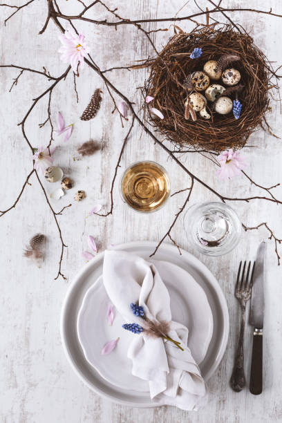 istock Table decoration for Easter with Plates, Covers, Bird's Nest. Happy Easter 1130402906