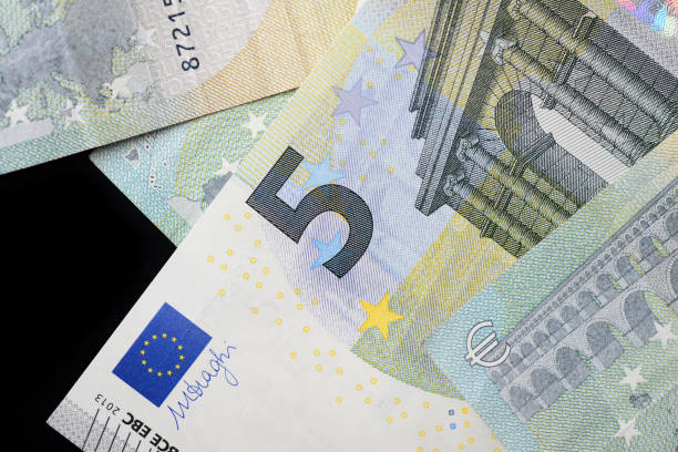 istock Five euro banknotes on a dark background close up 1130405214