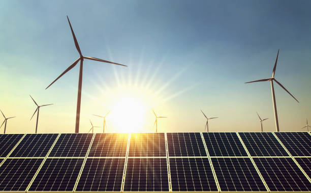 istock concept clean energy power in nature. solar panel and wind turbine with sun background 1130406105