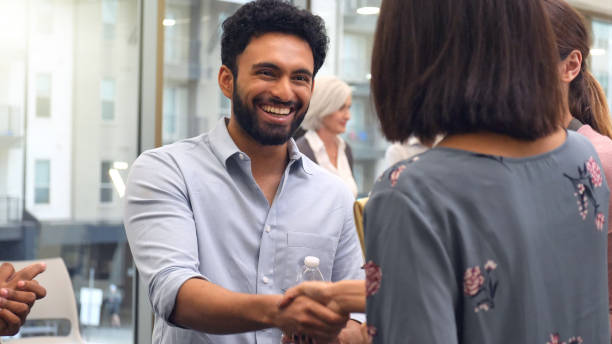 istock Young businessman shakes hands during interview 1130406829