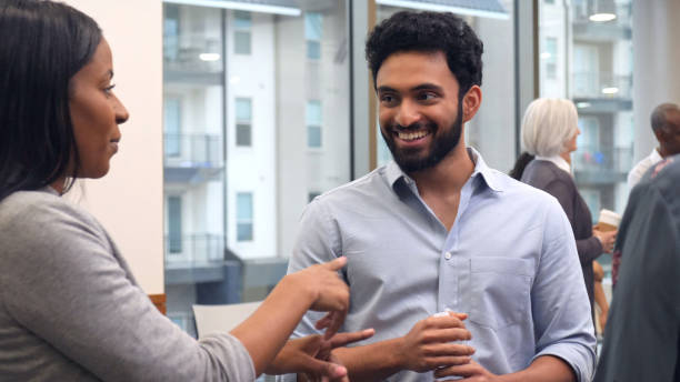 istock Young businessman enjoys socializing after meeting 1130406835