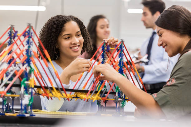 istock Happy high school students build bridge in class 1130406901