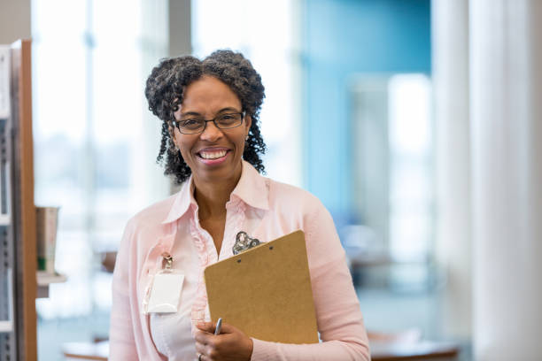 istock Smiling mature school teacher 1130407066