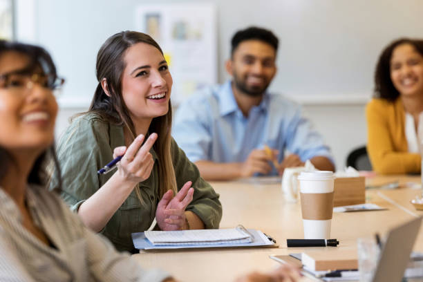 istock Young creative professional talks during staff meeting 1130407593