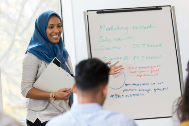istock Confident businesswoman gives presentation 1130407603