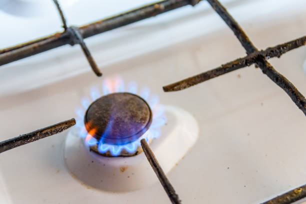 istock Gas burner on the white kitchen stove 1130407842