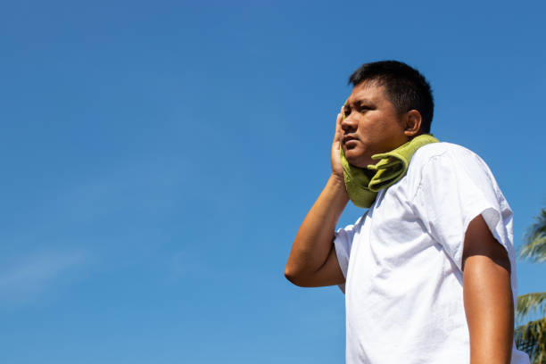istock Young man and heat stroke. 1130410129