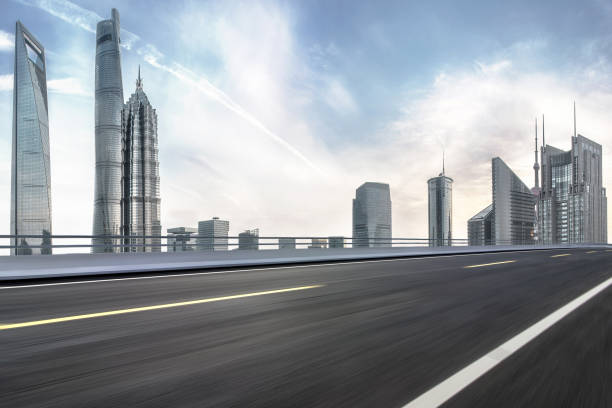 istock Road through the bridge with shanghai city skyline background 1130410491