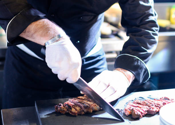 istock Chef preparing food, meal, in the kitchen, chef cooking, Chef decorating dish 1130411162