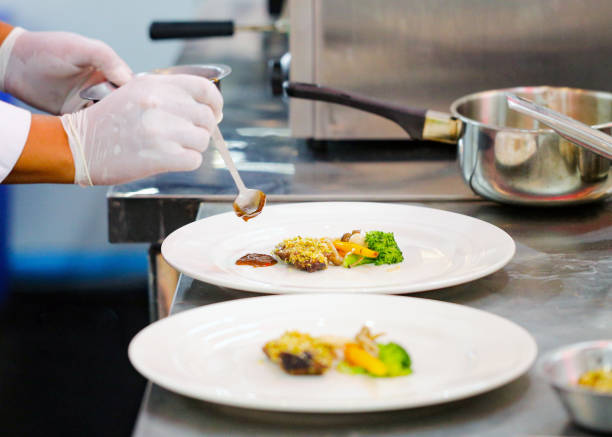 istock Chef preparing food, meal, in the kitchen, chef cooking, Chef decorating dish 1130411172
