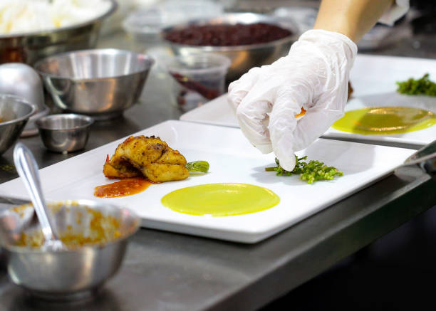 istock Chef preparing food, meal, in the kitchen, chef cooking, Chef decorating dish 1130411182