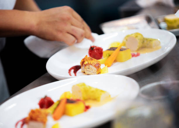 istock Chef preparing food, meal, in the kitchen, chef cooking, Chef decorating dish 1130411197
