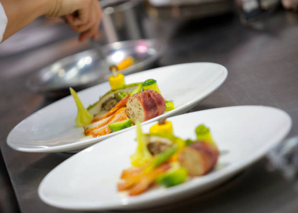 istock Chef preparing food, meal, in the kitchen, chef cooking, Chef decorating dish 1130411206