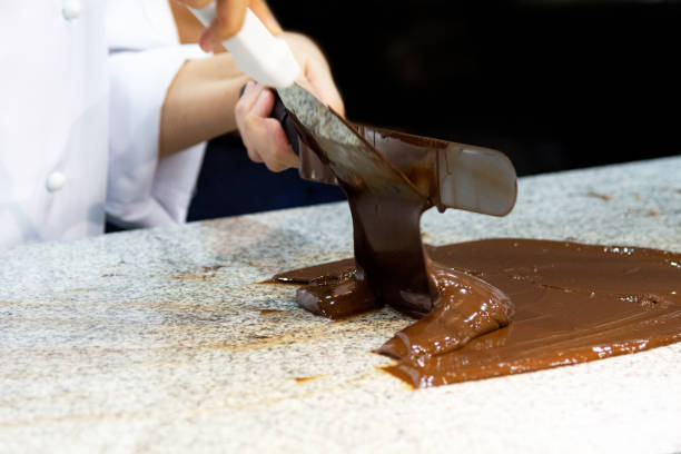 istock Chocolate fudge frosting, making chocolate fudge 1130411228