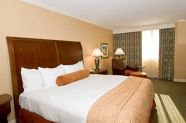 istock Hotel room with queen bed 113041245