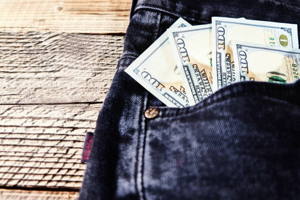 istock Dollar bills in the back pocket of jeans 1130412453