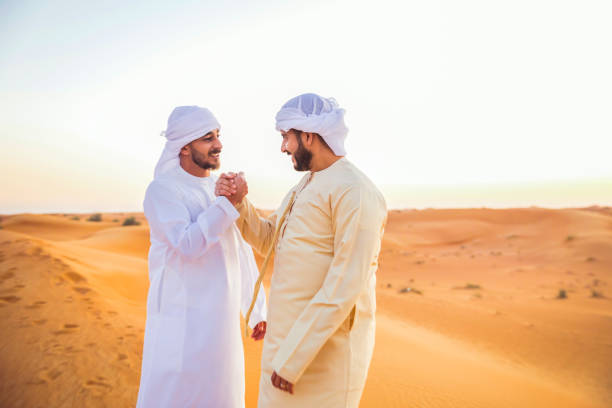 Friendship, Arab, Unity, Brothers, Portrait, Culture - Two Arabs Expressing Strong Unity with a Handshake